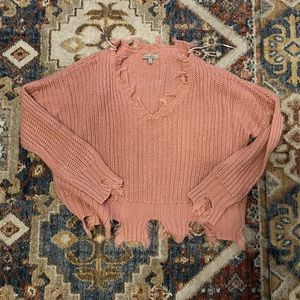 Cropped distressed sweater. Pink